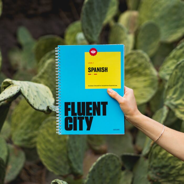 person holding Fluent City book