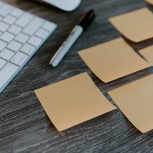 brown sticky notes on apple keyboard